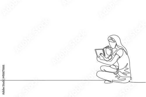 One single line drawing of young mom siting on floor and reading story book to her son at home vector graphic illustration. Happy family parenting concept. Modern continuous line draw design