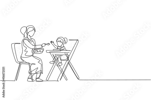 Single continuous line drawing young mom feeding her daughter a meal who sit at baby dining chair, happy parenting. Family loving care concept. Trendy one line draw design graphic vector illustration