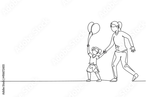 Single continuous line drawing of young mother and her daughter go to night carnival festival while the kid holding balloon. Happy family parenthood concept. One line draw design vector illustration