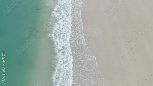 waves of the sea on an empty beach