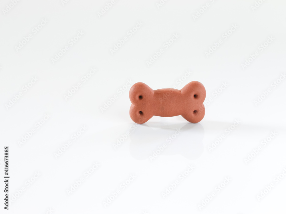 Dog biscuits , dog snack or dog chew in shape of bone on whithe background. Dog biscuits , dog snack or dog chew in shape of bone on whithe background.