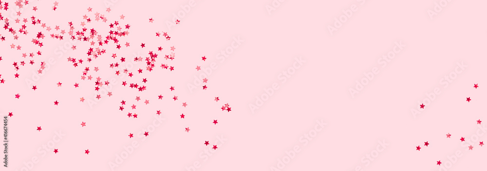 scattered pink holographic glitter confetti star shaped on candy pink background Flat lay top view copy space. Festive holiday pastel backdrop. Birthday, giveaway, Christmas, New Year scattered pink holographic glitter confetti star shaped on candy pink background Flat lay top view copy space. Festive holiday pastel backdrop. Birthday, giveaway, Christmas, New Year