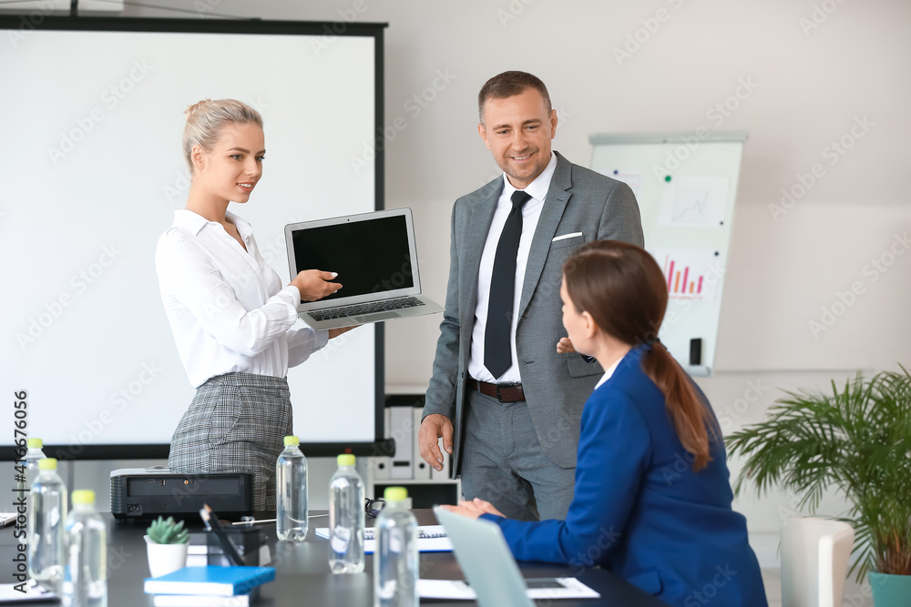 Business people giving presentation during meeting in office Business people giving presentation during meeting in office