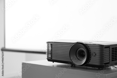 Video projector on table in...