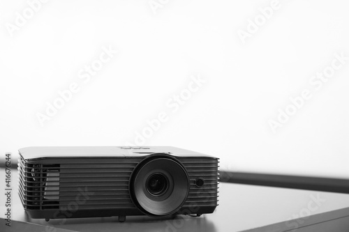Video projector on table in...