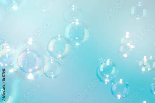 Beautiful colorful transparent shiny soap bubbles background.