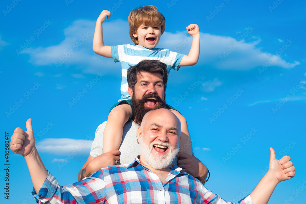 Man family outdoor. Happy three generations of men have fun and smiling on blue sky background. Grandfather father and grandson, son.