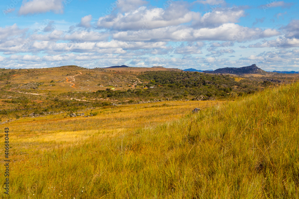 Landscape close to Diamantina with green gras and blue cloudy sky, Minas Gerais, Brazil