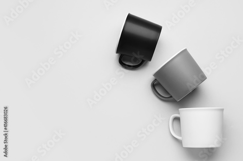 Empty cups on light background