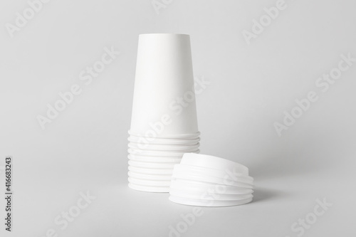 Blank takeaway cups on ligh...