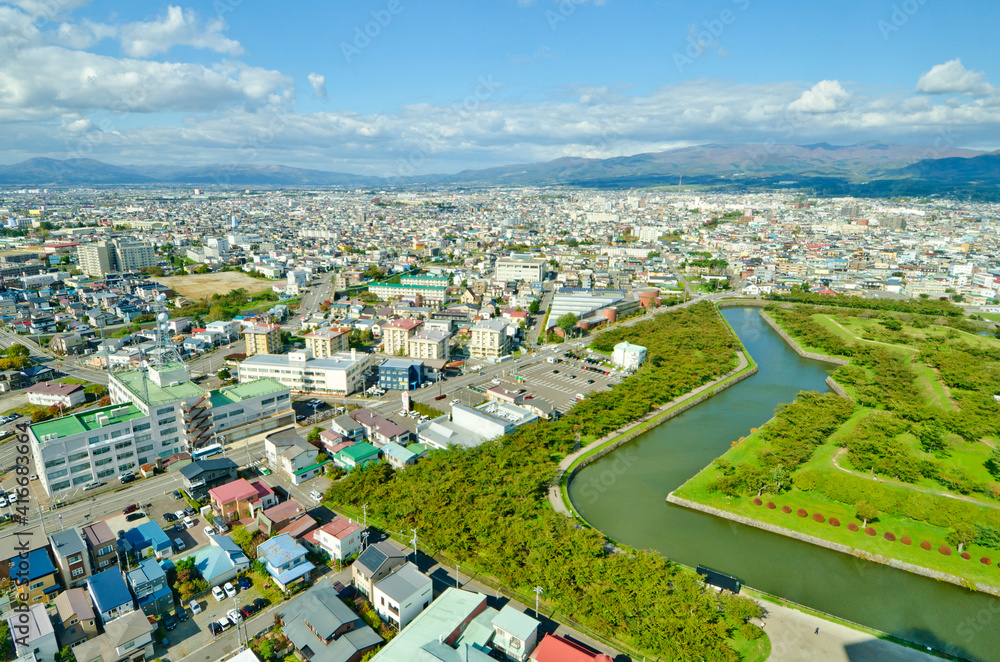 Outer moat of goryokaku park and goryokaku Tower in Hakodate, Hokkaido, Japan.