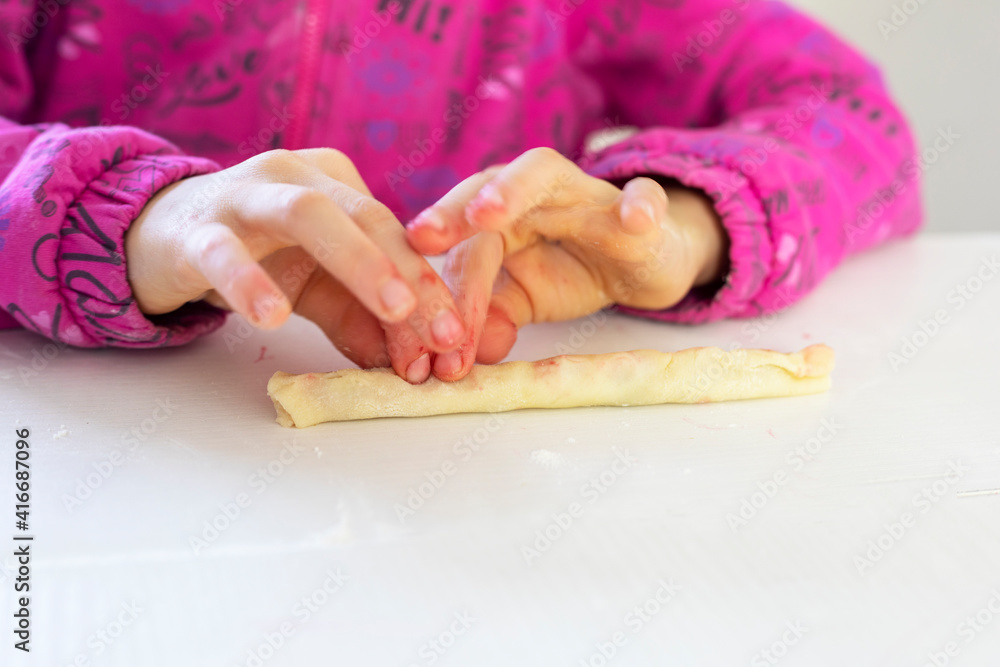 little chef twirls cherries into dough for sweet pie, horizontal little chef twirls cherries into dough for sweet pie, horizontal