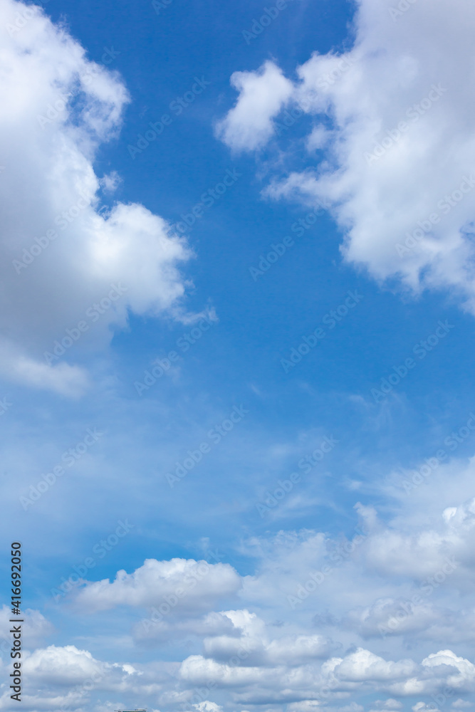 Beautiful light blue sky with cloud for background. the Cumulus cloud with the sun in midday. Beautiful light blue sky with cloud for background. the Cumulus cloud with the sun in midday.