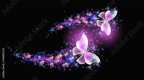 Magic two butterflies with fantasy sparkle, blazing trail and glowing stars on black background
