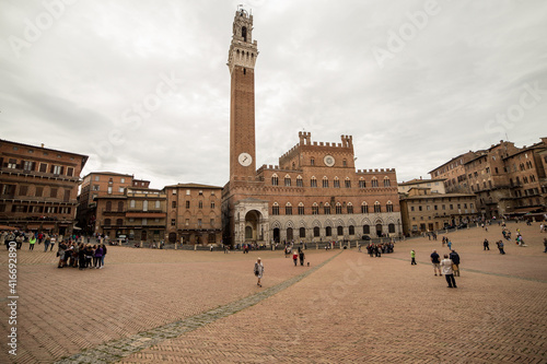 View to Siena to campanille Torre del Mangia on piazza del Campo