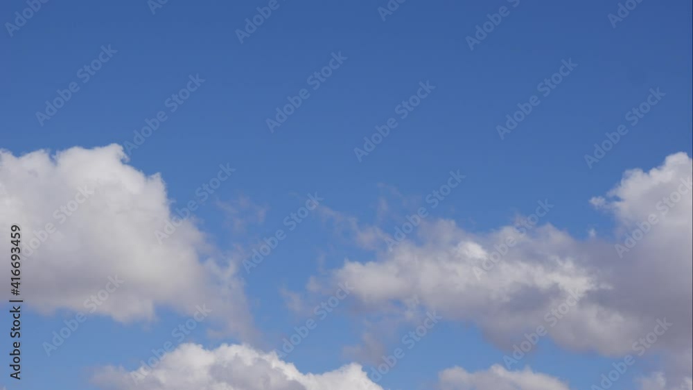 Blue sky white clouds. Puffy fluffy white clouds. Cumulus cloud scape timelapse. Summer blue sky time lapse. Dramatic majestic amazing blue sky. Soft white clouds form. Clouds time lapse background Blue sky white clouds. Puffy fluffy white clouds. Cumulus cloud scape timelapse. Summer blue sky time lapse. Dramatic majestic amazing blue sky. Soft white clouds form. Clouds time lapse background
