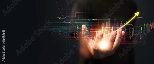 Businessman holding the glow light Data digital marketing graph in dark background. 3D illustration in Technology concepts. photo
