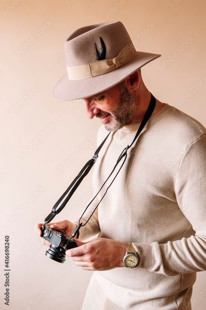45 year old man with modern digital camera 45 year old man with modern digital camera