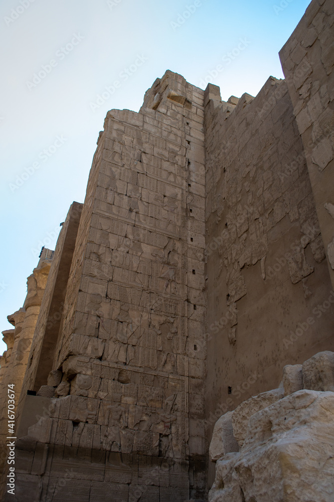 KARNAK TEMPLE - Massive columns inside beautiful Egyptian landmark with hieroglyphics, and ancient symbols. Famous landmark in the world near the Nile River and Luxor, Egypt KARNAK TEMPLE - Massive columns inside beautiful Egyptian landmark with hieroglyphics, and ancient symbols. Famous landmark in the world near the Nile River and Luxor, Egypt