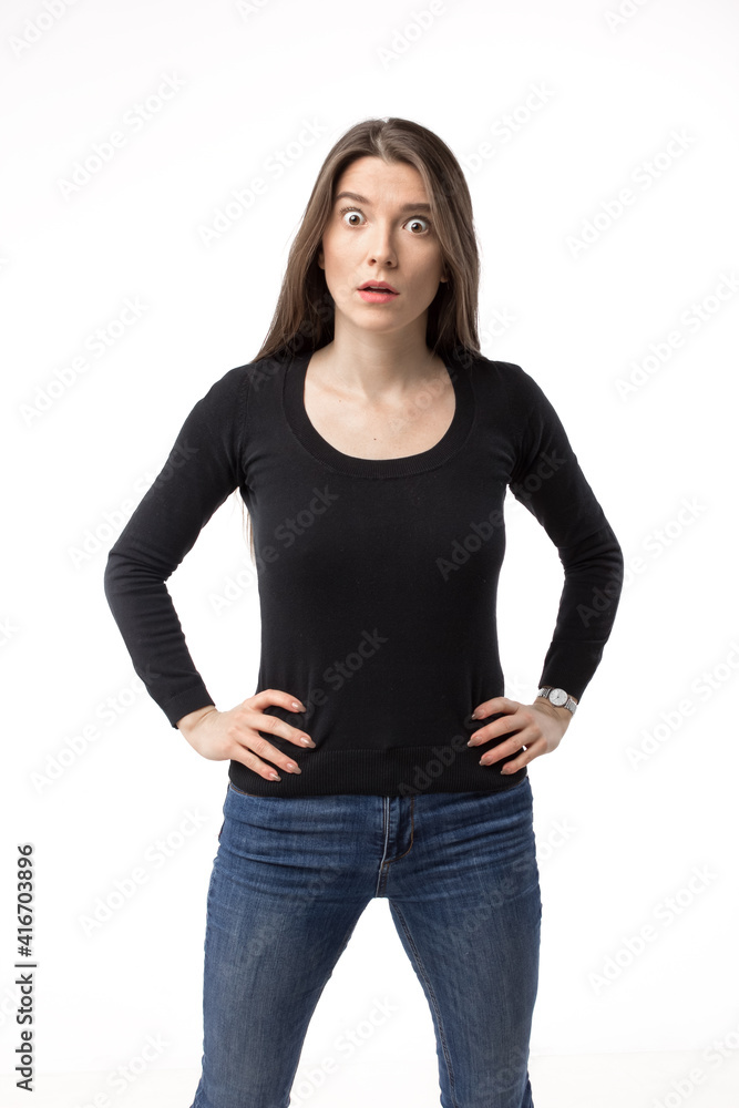 Obraz premium Isolated portrait of a surprised and shocked young woman looking at camera.