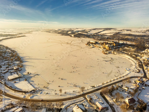 Der komplett zugefrorene Süße See bei Seeburg mit dem historischen Schloss als Geheimtipp für Touristen in Mitteldeutschland photo