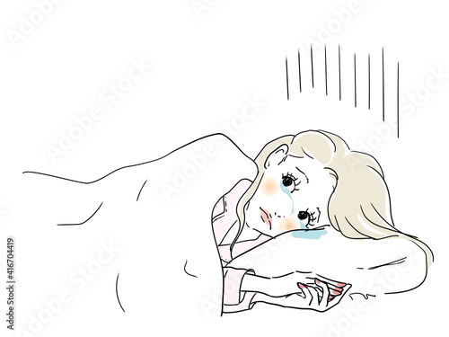 悲しい事があり眠れない女性