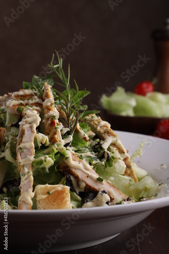 chicken and beef steak outstanding presentation, ceaser salad, pasta & tempting food on table top photography photo