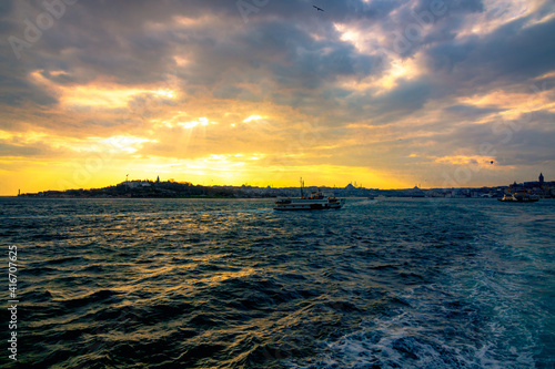 cityscape of Istanbul and a ferry at sunset. Istanbul background photo. Istanbul city line ferries background. Bosphorus and constantinople.