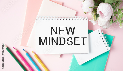 Notebook with Tools and Notes with text New Mindset business