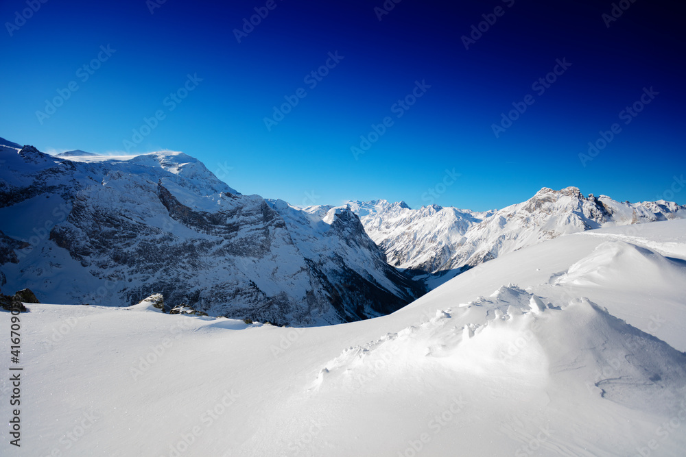 Peaks on Pralognan-la-Vanoise ski resort on sunny snow day, French Alps