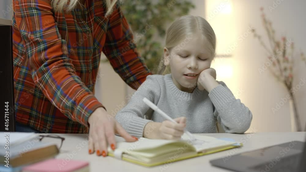 Strict mom scolding little daughter for bad grades, child ignoring her parent Strict mom scolding little daughter for bad grades, child ignoring her parent
