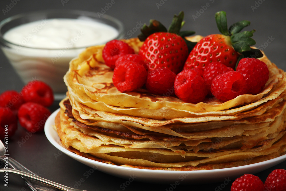 Russian cuisine national dish bliny with fresh berries Russian cuisine national dish bliny with fresh berries