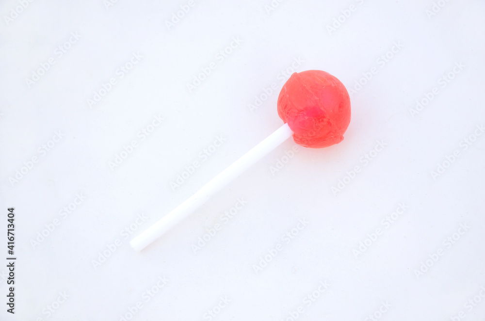 the sweet pink lollypop isolated on white background. the sweet pink lollypop isolated on white background.