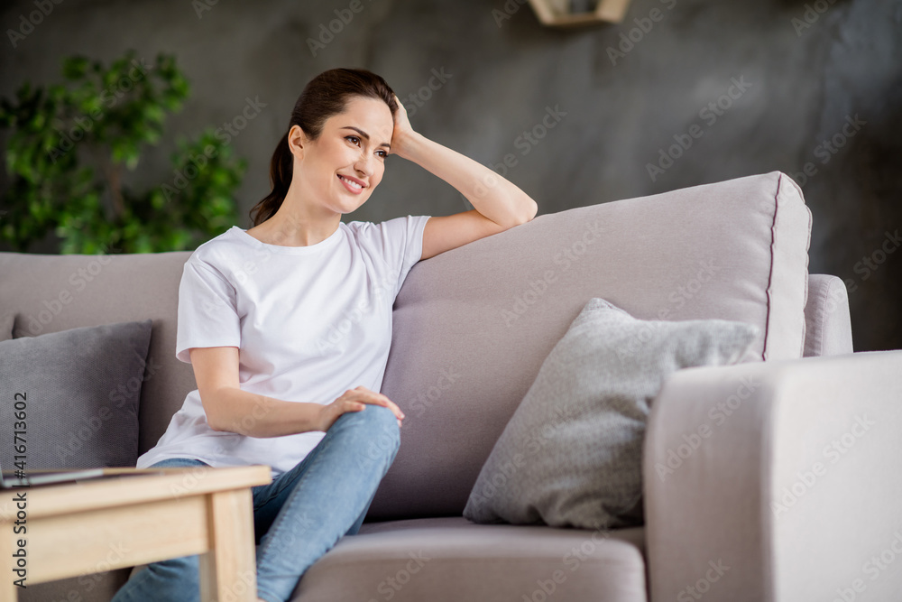 Photo of young happy cheerful smiling good mood businesswoman sit sofa having a break relaxing at home house Photo of young happy cheerful smiling good mood businesswoman sit sofa having a break relaxing at home house