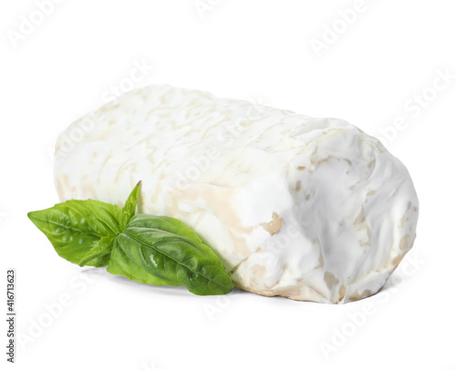 Delicious fresh goat cheese with basil on white background