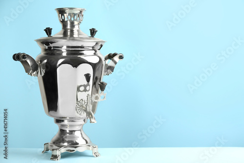 Slika na platnu Traditional Russian samovar on light blue background