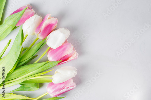 Fototapeta Naklejka Na Ścianę i Meble -  Bouquet of white and pink tulips on a white background. Spring mood, blossoming flowers for romantic, love atmosphere for holiday. Copy space, selective focus