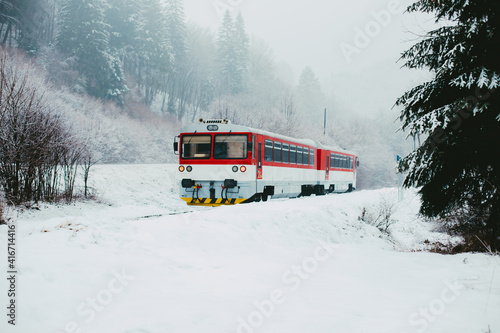 Train crossing snow covered landscape.High quality photo