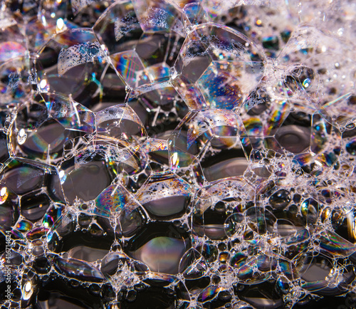Soap bubbles on a black background, close-up, copy space, macro, pattern, texture