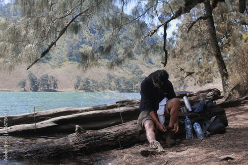 fasten the shoelaces, Ranukumbolo Lake, East Java, Indonesia photo