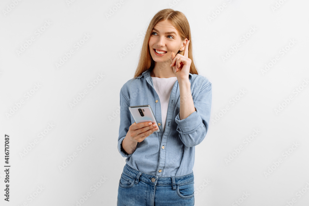 woman using phone and looking to the side at copy space on white background woman using phone and looking to the side at copy space on white background