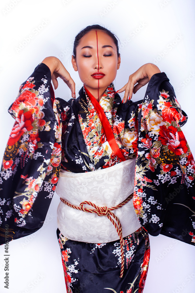 Fototapeta premium young pretty geisha in black kimono with sakura, asian ethno closeup on white background isolated