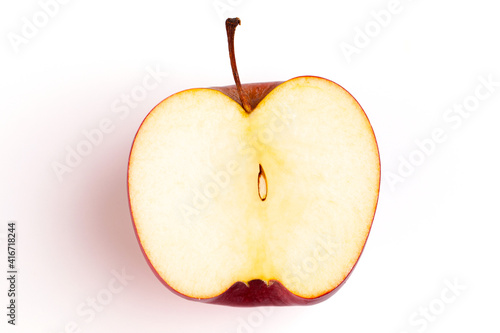An apple fruit with full and a half showing in isolated background.