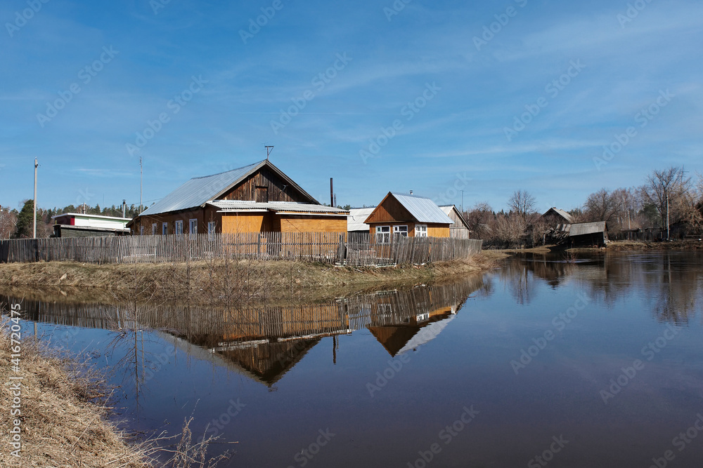 High spring tides flooding the harbour at Thornham on the Norfolk coast