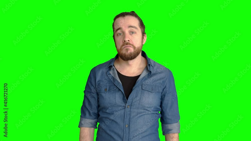 Man with beard and blue shirt shrugs his shoulders and looks around.
Man says Man with beard and blue shirt shrugs his shoulders and looks around.
Man says
