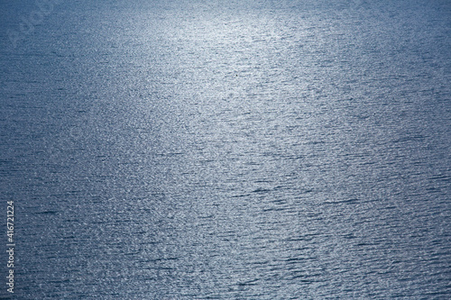 Blue tropical sea surface with waves and ripples