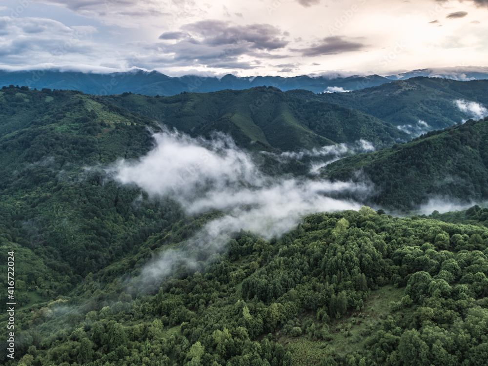 Aerial view of green mountain in cloudy day Aerial view of green mountain in cloudy day