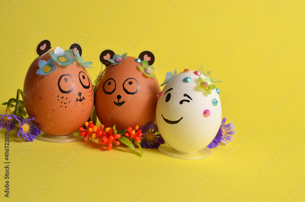 Three Easter eggs with funny faces. Spring. Easter. Three Easter eggs with funny faces. Spring. Easter.