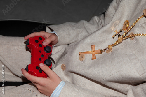 child of communion playing video game