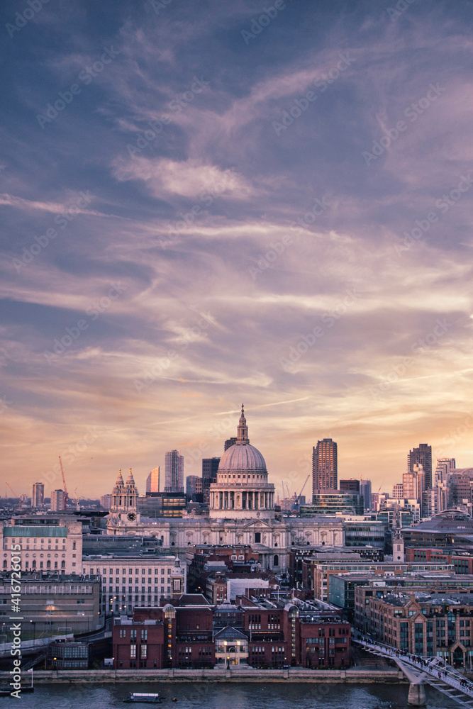 Stunning view of St Paul's Cathedral and London cityscape under the mesmerizing sunset sky
